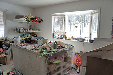 Susan Ullman's workspace where she creates her mixed media collages and handmade papers.